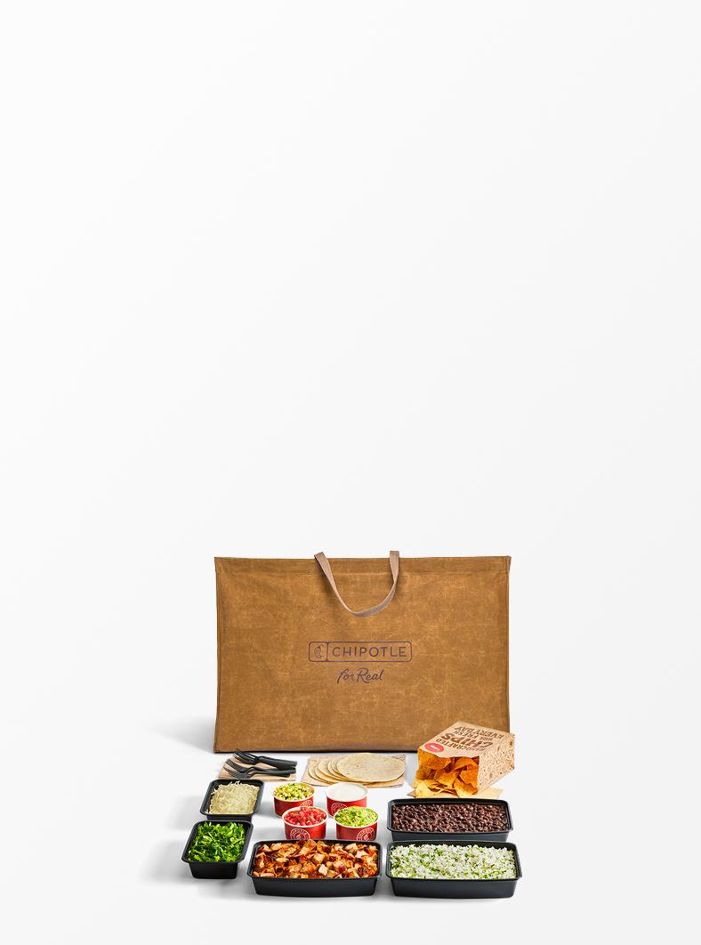 A Chipotle Big Ass Bag sitting behind a full Build Your Own Chipotle meal.